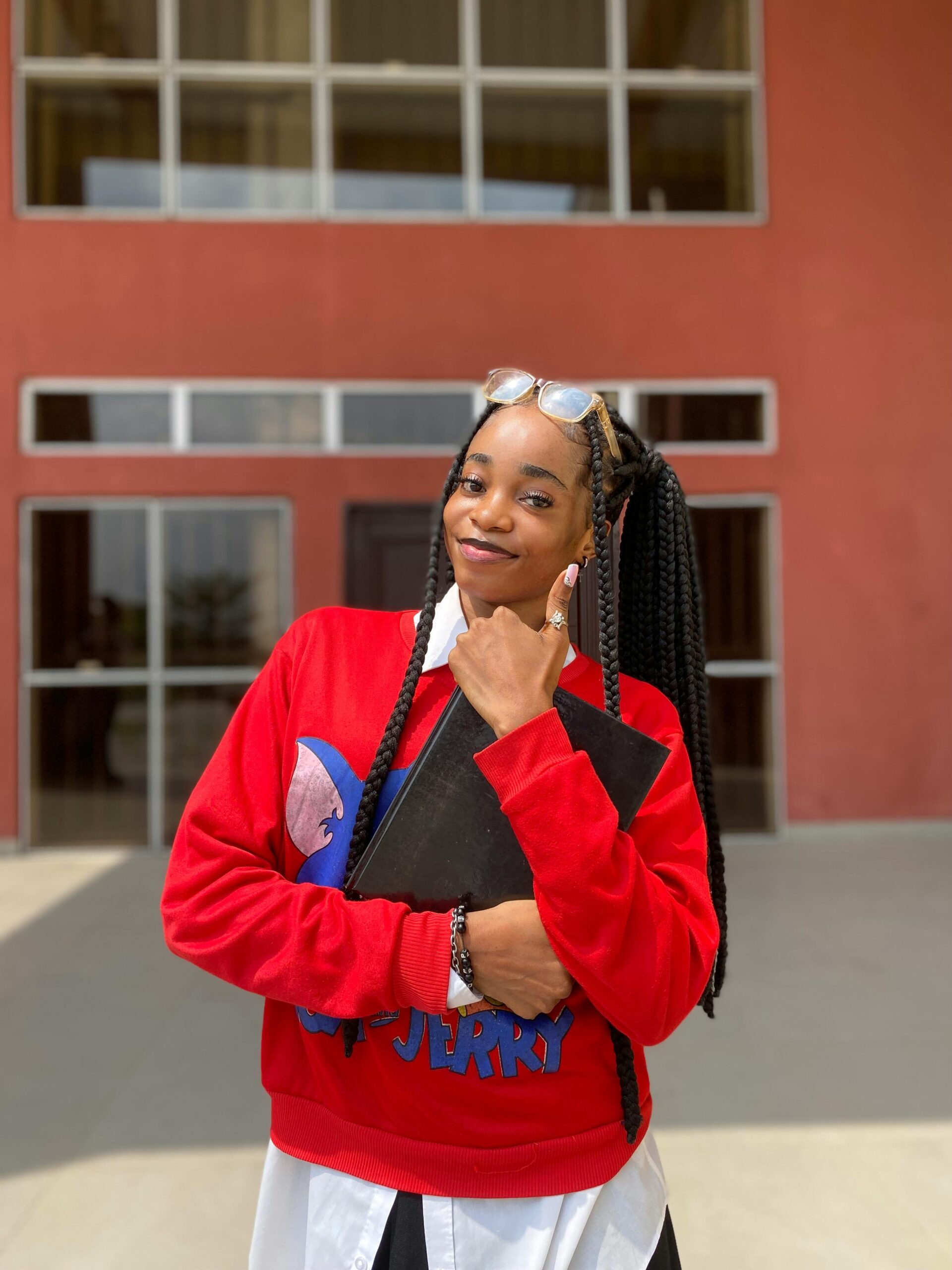 Portrait of a smiling Nigerian teenager female student