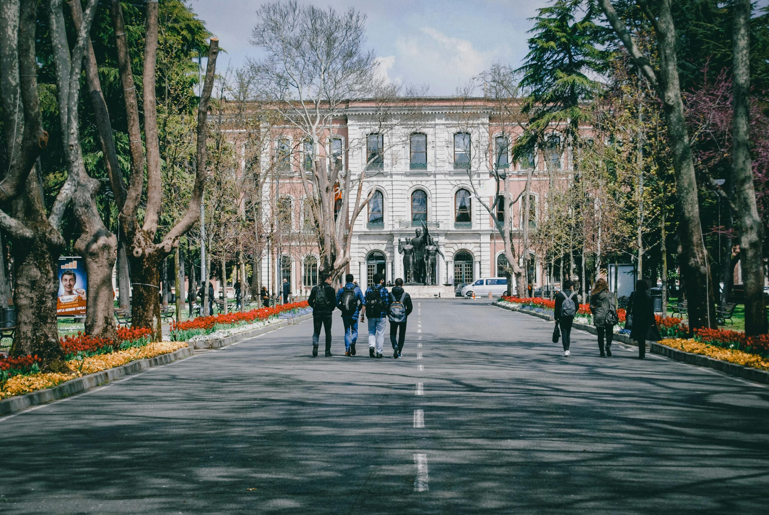 University campus with students walking in Spring