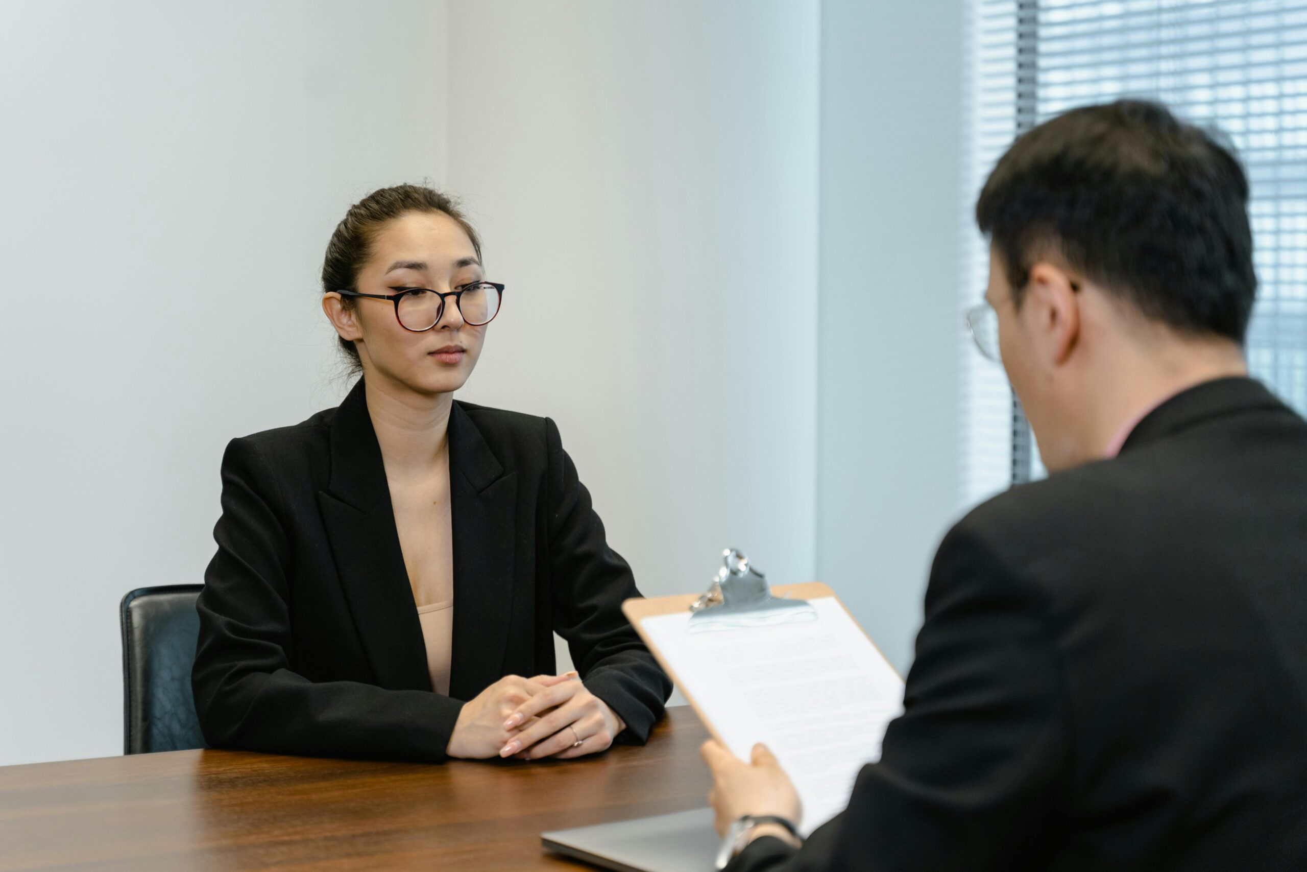 A lady who applied for a visa sitting for her visa interview with a male visa officer