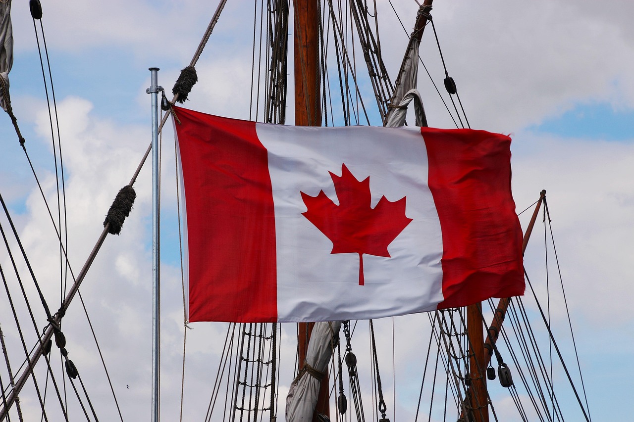 Canadian flag hanging on two poles